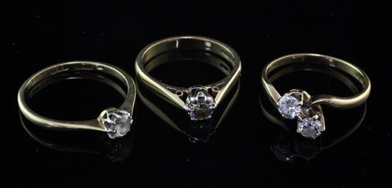 Three 18ct gold and diamond rings, various sizes.